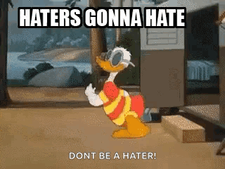 A Cartoon Of Donald Duck Standing In Front Of A Trailer With The Words `` Haters Gonna Hate Dont Be A Hater '' GIF