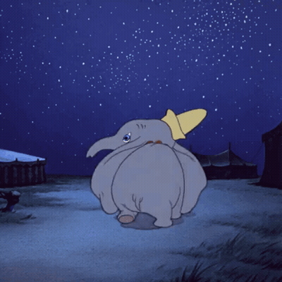 A Cartoon Of Dumbo Looking Up At The Sky GIF