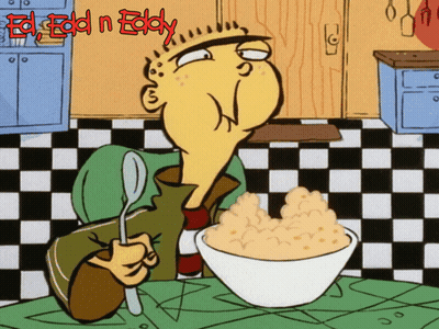 A Cartoon Of Ed Holding A Spoon And A Bowl Of Cereal With The Words Ed Edd N Eddy Above Him GIF