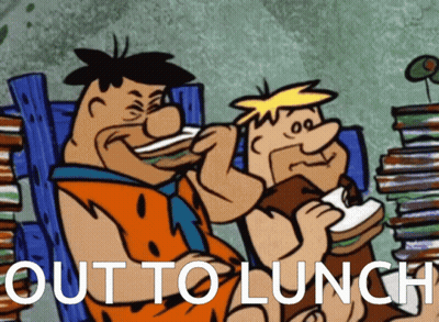 A Cartoon Of Flintstone And Barry Eating Sandwiches With The Caption Out To Lunch GIF
