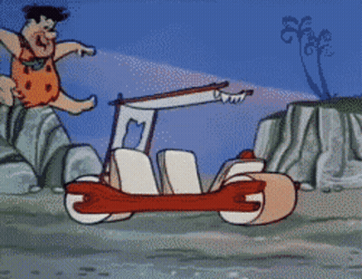 A Cartoon Of Flintstone Driving A Car That Looks Like A Motorcycle GIF