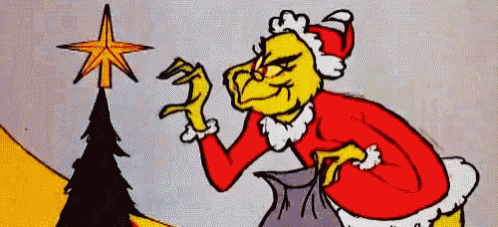 A Cartoon Of Grinch Standing Next To A Christmas Tree With A Star On Top Of It . GIF