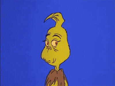A Cartoon Of Grinch With A Very Angry Look On His Face Against A Blue Background . GIF