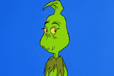 A Cartoon Of Grinch With A Very Angry Look On His Face GIF