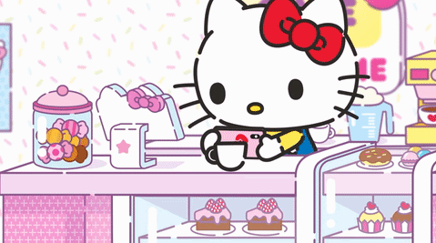 A Cartoon Of Hello Kitty Sitting At A Counter With A Cup Of Coffee GIF