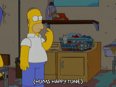 A Cartoon Of Homer Simpson Holding A Laundry Basket And Saying " Hums Happy Tune " GIF