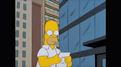 A Cartoon Of Homer Simpson Holding A Piece Of Paper In Front Of A Building GIF