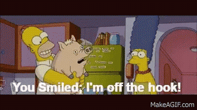 A Cartoon Of Homer Simpson Holding A Pig With The Words " You Smiled I 'M Off The Hook " GIF