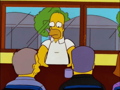 A Cartoon Of Homer Simpson Sitting At A Table With Two Other Men GIF