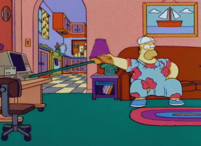 A Cartoon Of Homer Simpson Sitting On A Couch Holding A Stick GIF
