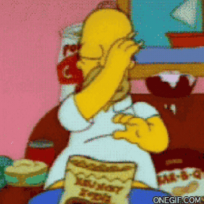 A Cartoon Of Homer Simpson Sitting On A Couch With A Bag Of Honey Bunches Of Oats GIF