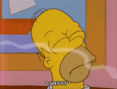 A Cartoon Of Homer Simpson Sniffing Something With His Mouth Open GIF