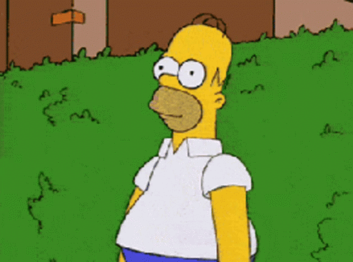 A Cartoon Of Homer Simpson Standing In A Grassy Area GIF