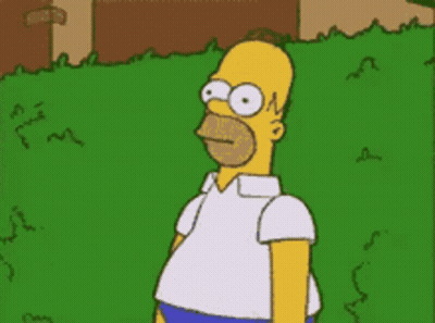 A Cartoon Of Homer Simpson Standing In Front Of A Fence GIF