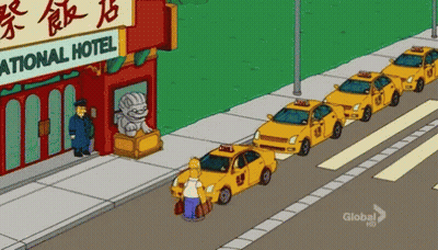 A Cartoon Of Homer Simpson Standing In Front Of A Row Of Yellow Taxis GIF
