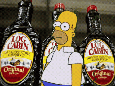 A Cartoon Of Homer Simpson Standing In Front Of Bottles Of Log Cabin Syrup GIF