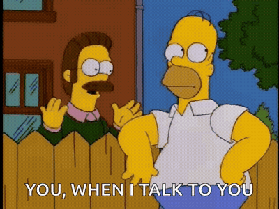A Cartoon Of Homer Simpson Talking To Ned Flanders GIF