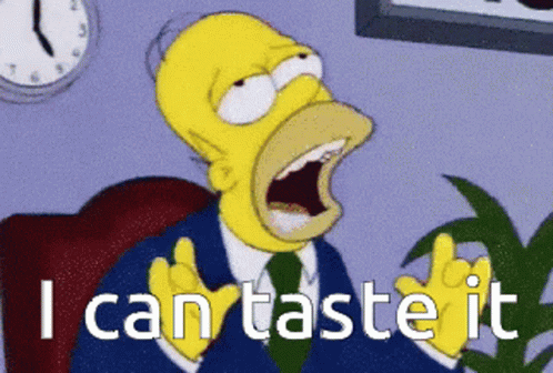 A Cartoon Of Homer Simpson With His Mouth Open And The Words I Can Taste It GIF