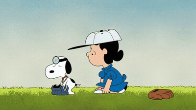 A Cartoon Of Lucy And Snoopy With A Baseball Glove On The Ground GIF