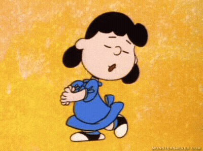 A Cartoon Of Lucy Brown From The Peanuts Movie Is Dancing . GIF