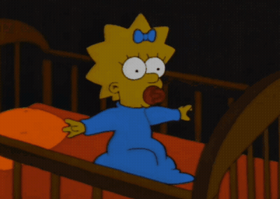 A Cartoon Of Maggie Simpson Sitting In A Crib With A Pacifier In Her Mouth GIF