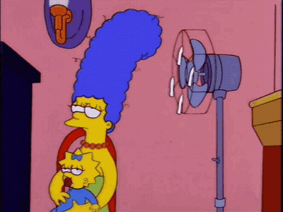 A Cartoon Of Marge Simpson And Maggie Simpson In Front Of A Fan GIF