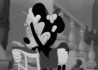 A Cartoon Of Mickey Mouse Reading A Newspaper GIF