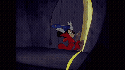 A Cartoon Of Mickey Mouse Wearing A Wizard Costume GIF