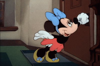 A Cartoon Of Minnie Mouse Standing In Front Of A Door Waving GIF