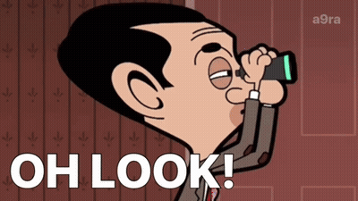 A Cartoon Of Mr Bean Looking Through Binoculars With The Words Oh Look Written Below Him GIF