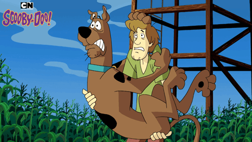 A Cartoon Of Scooby Doo Carrying A Man GIF
