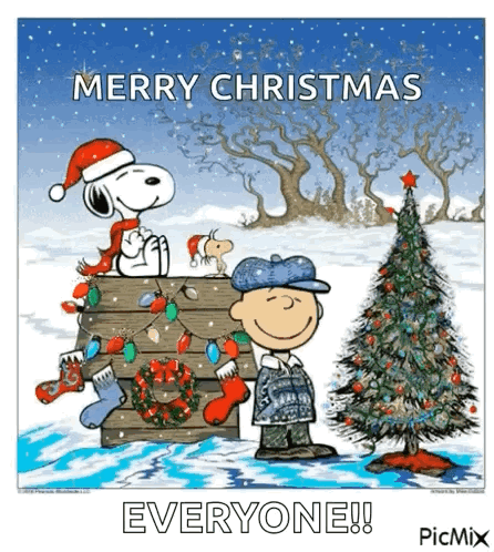 A Cartoon Of Snoopy And Charlie Brown Standing Next To A Christmas Tree GIF
