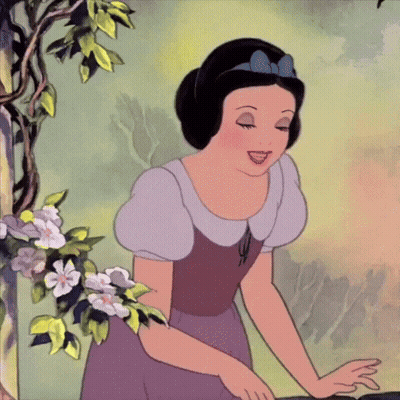 A Cartoon Of Snow White Standing In Front Of Some Flowers GIF