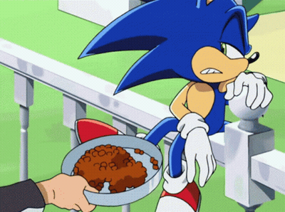A Cartoon Of Sonic The Hedgehog With A Bowl Of Food In Front Of Him GIF