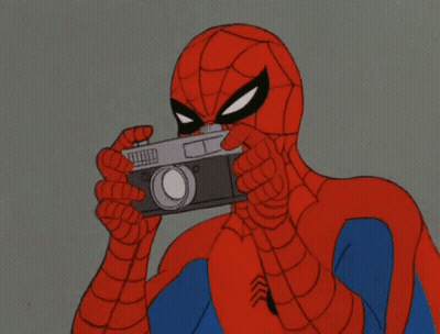 A Cartoon Of Spider-Man Taking A Picture With His Camera GIF