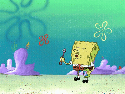 A Cartoon Of Spongebob Blowing Soap Bubbles In The Ocean GIF
