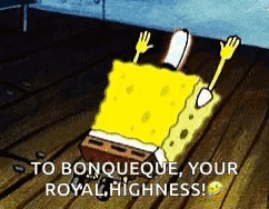 A Cartoon Of Spongebob Laying On A Wooden Floor With The Words `` To Bonqueque Your Royal Highness '' . GIF