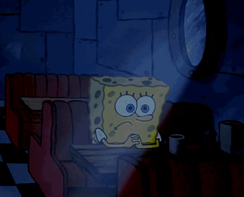 A Cartoon Of Spongebob Squarepants Sitting At A Table In A Diner GIF