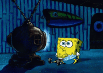 A Cartoon Of Spongebob Squarepants Sitting In Front Of A Tv GIF
