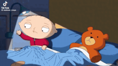 A Cartoon Of Stewie From Family Guy Laying In Bed Next To A Teddy Bear GIF