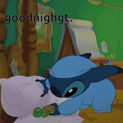 A Cartoon Of Stitch Laying In Bed With The Words Goodnight Above Him GIF