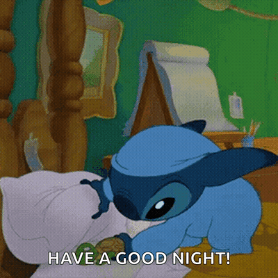A Cartoon Of Stitch Laying On A Bed With The Caption Have A Good Night GIF