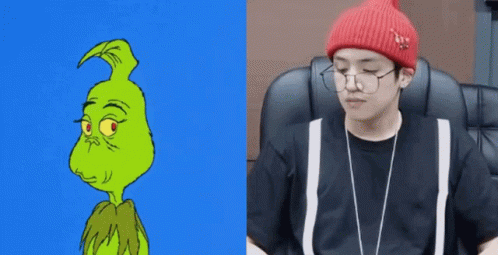 A Cartoon Of The Grinch Next To A Picture Of A Man Wearing Glasses And A Beanie GIF