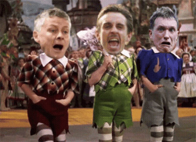 A Cartoon Of Three Men Standing Next To Each Other With Their Faces On Their Shirts GIF
