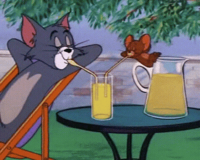 A Cartoon Of Tom And Jerry Drinking Orange Juice Through Straws GIF