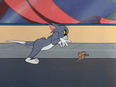 A Cartoon Of Tom And Jerry Playing With Each Other On A Sidewalk GIF