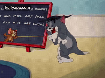 A Cartoon Of Tom And Jerry Standing Next To A Blackboard With A Quote On It . GIF