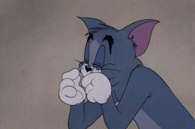 A Cartoon Of Tom Covering His Eyes With His Paws GIF