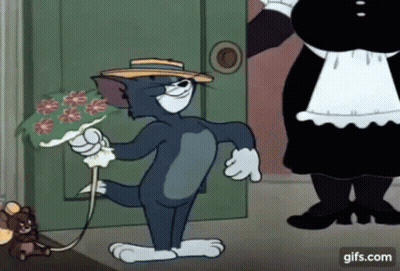 A Cartoon Of Tom Holding A Bouquet Of Flowers While Standing Next To A Maid . GIF
