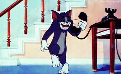 A Cartoon Of Tom Talking On A Phone While Walking Down Stairs GIF